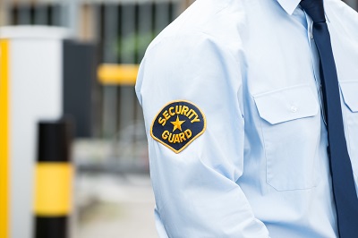 security guard standing at gate